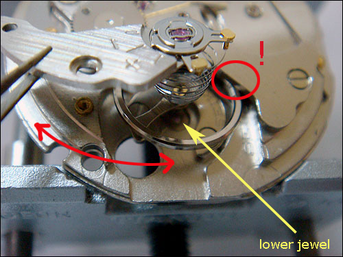 Seiko DIY Automatic Watch assembly and disassembly>
<p>
Once the wheel is out of the jewel, bring the cock towards yourself a bit to clear it from the bridge and 4th wheel.
<p><img src=